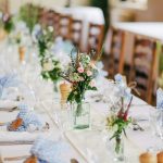 Luxury white wedding minibus in Liverpool with cathedral backdrop, professional wedding transport service